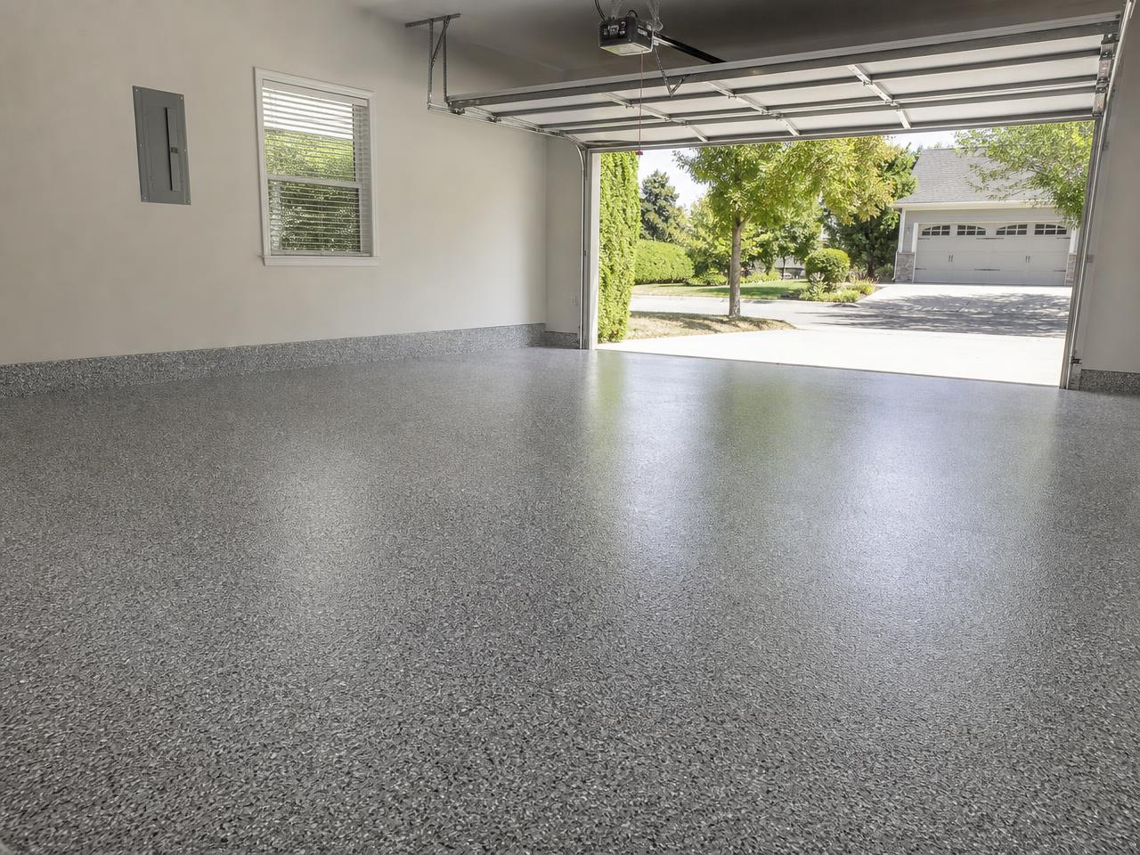 Two-car garage with a freshly installed gray flake floor coating