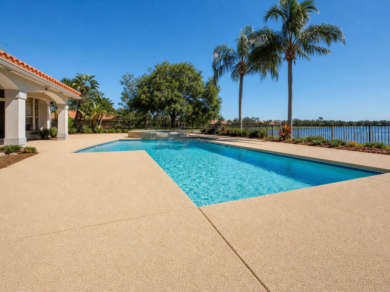 Textured cool deck coating around a residential swimming pool