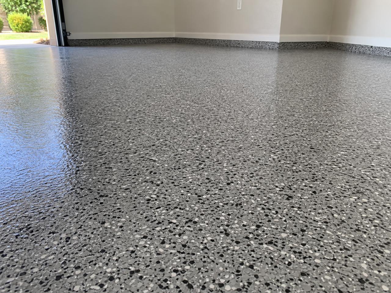 Finished gray flake epoxy coating on a residential garage floor