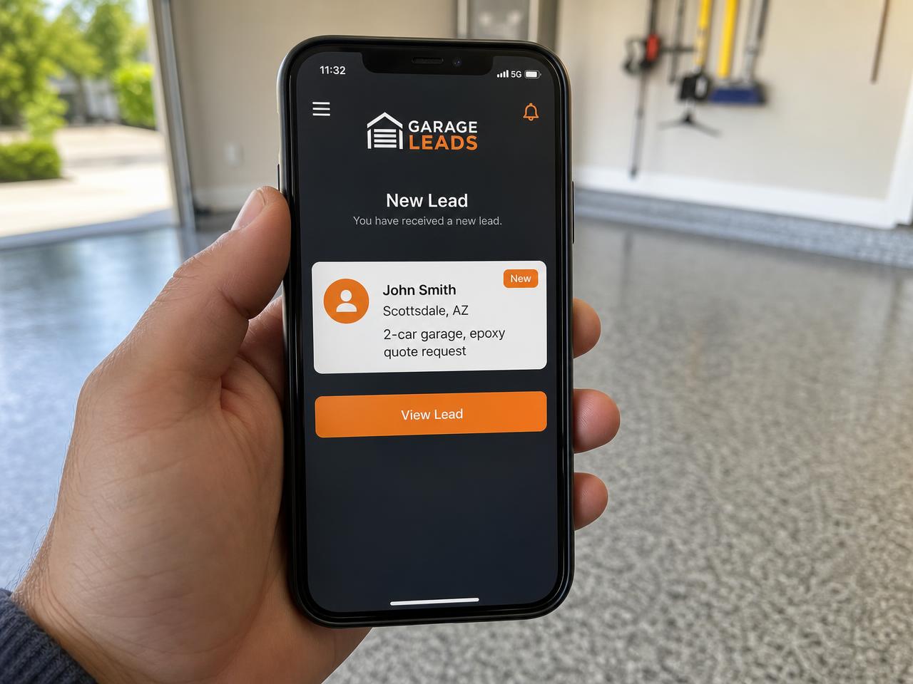 Contractor holding a phone showing a new verified floor coating lead alert with homeowner name, city, and project type