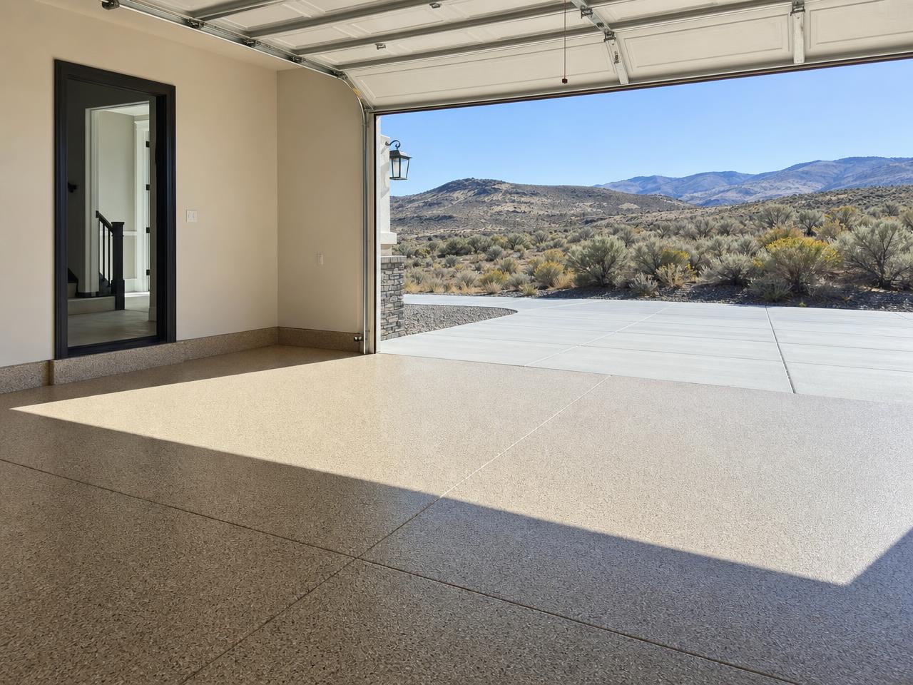 Boise garage with a tan flake coated floor and high desert foothills outside