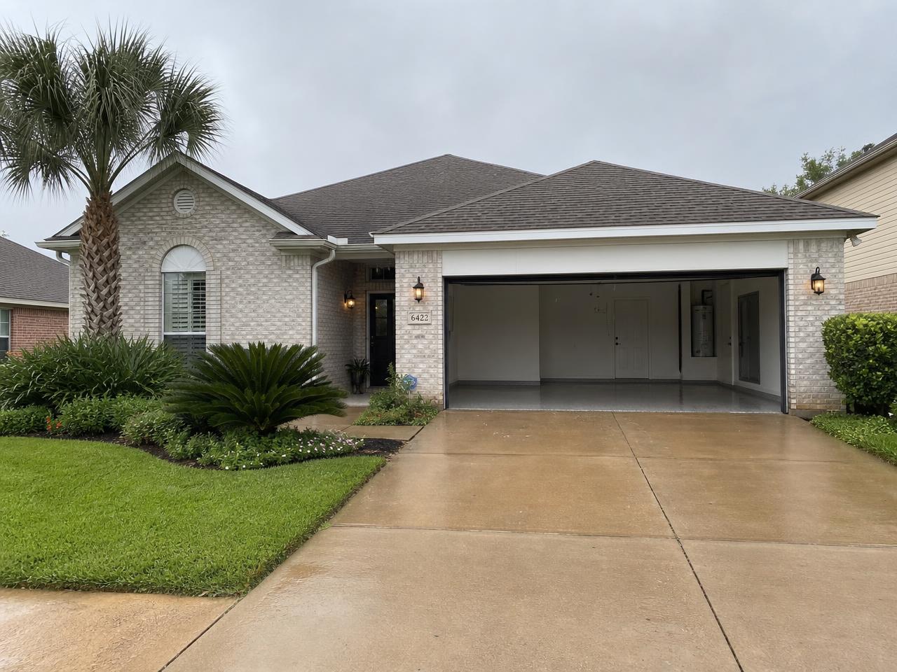 Gulf Coast suburban home with an attached garage on a concrete slab